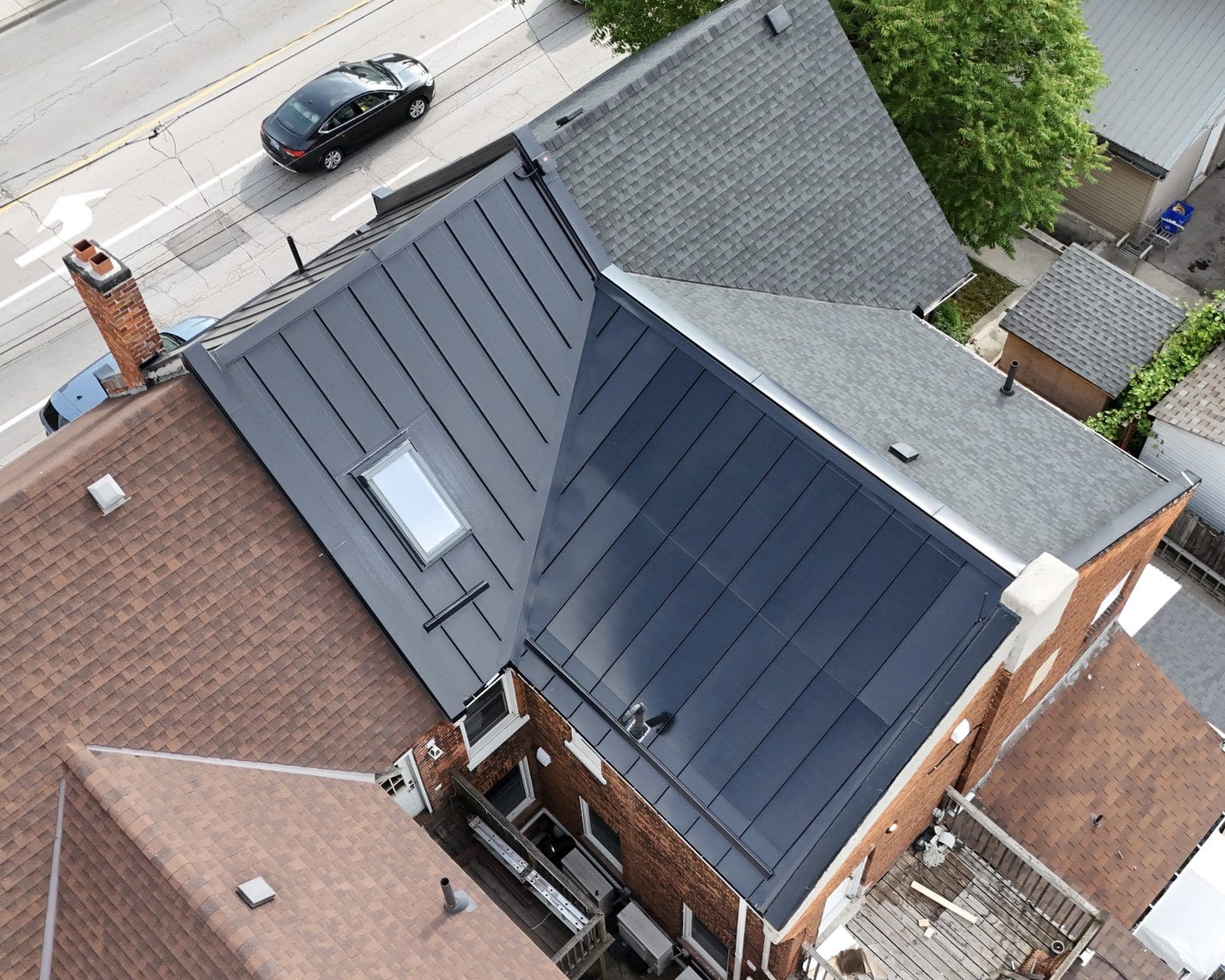 A arial view of a home with BIPV (Building Integrated Photovoltaics) as the roof. A solar panel roof. In Hamilton, Ontario