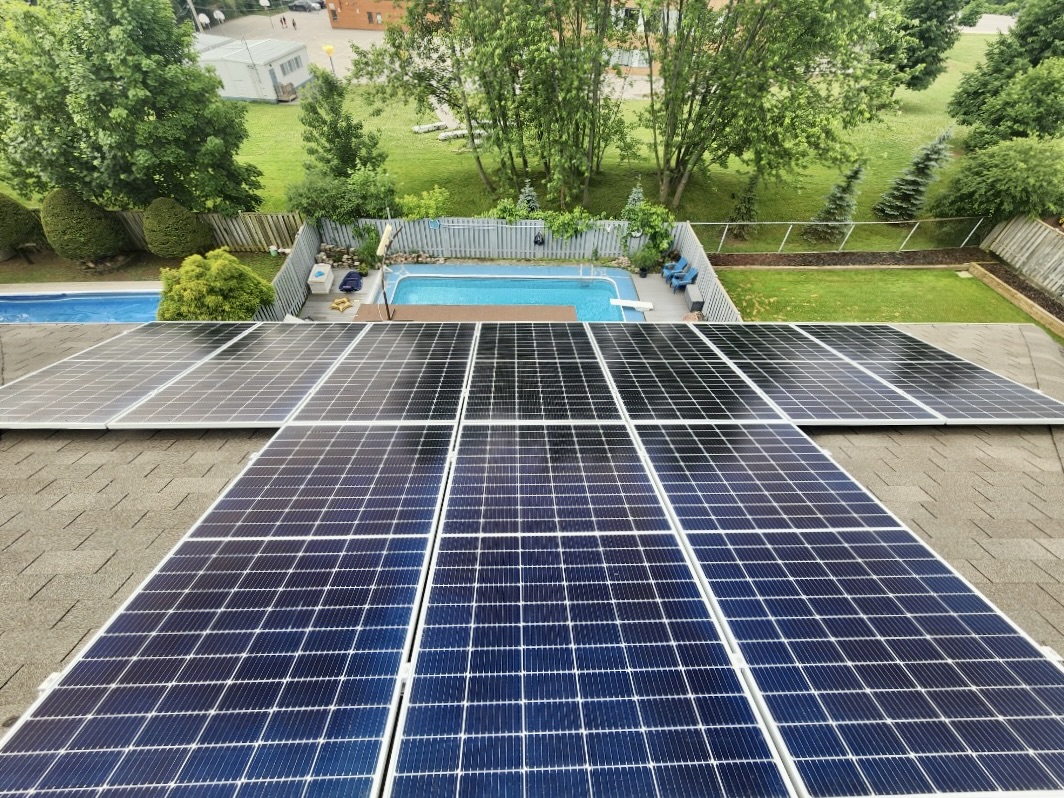 Stock image of a house with a asphalt shingle roof and solar panels on it in Ontario, Canada