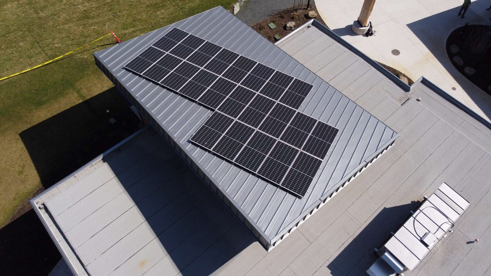 Top-down view of a non-profit community building with solar panels on the roof.