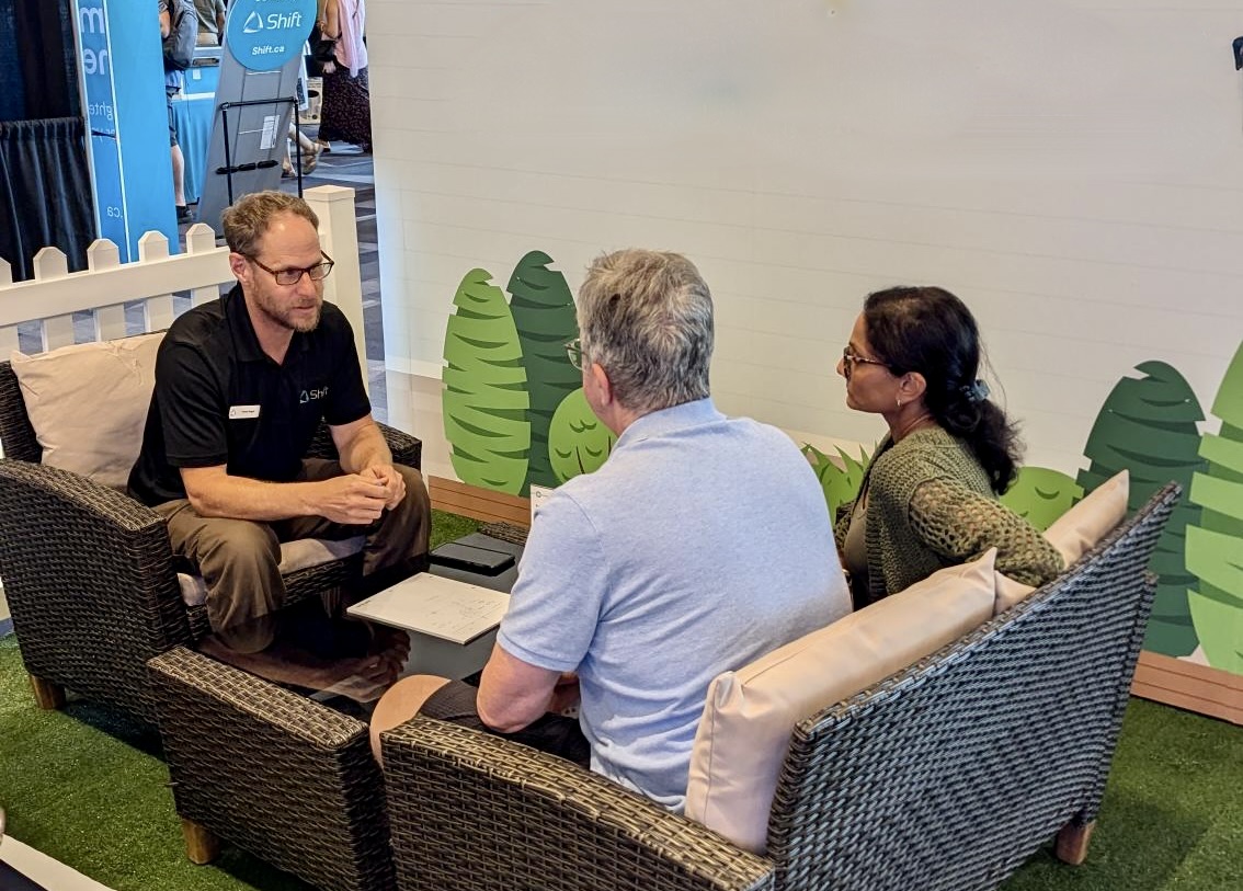 2 clients sitting down to have a meeting with one of our team members.