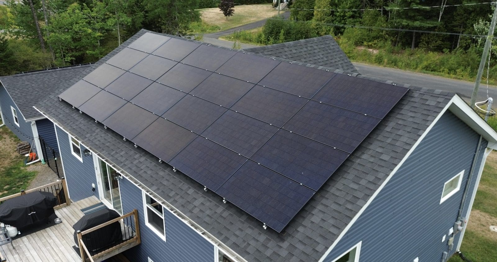 An aerial view of solar panels on a roof