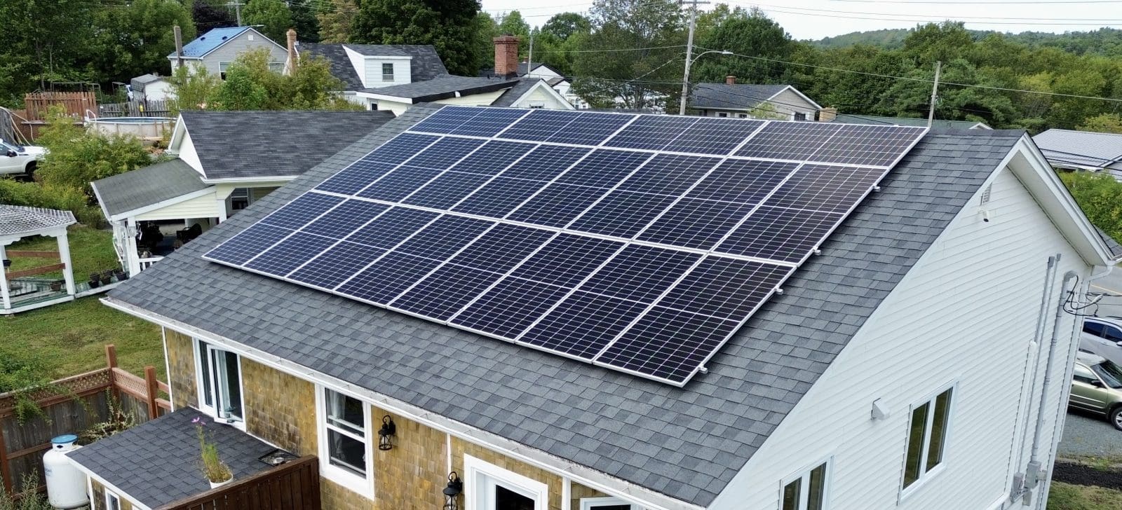 Roof top view of a home with solar panels
