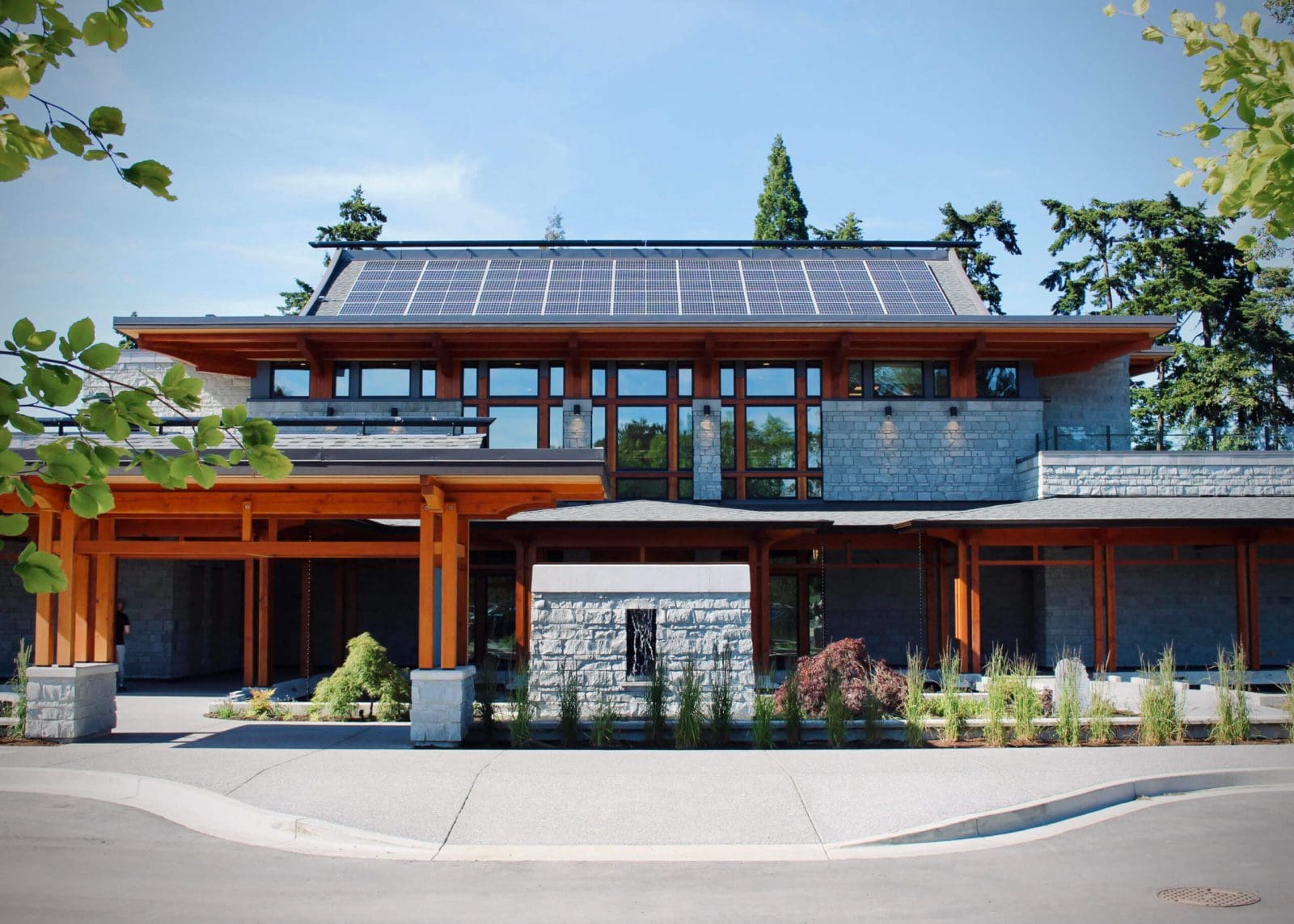 A community building with solar panels on the roof.